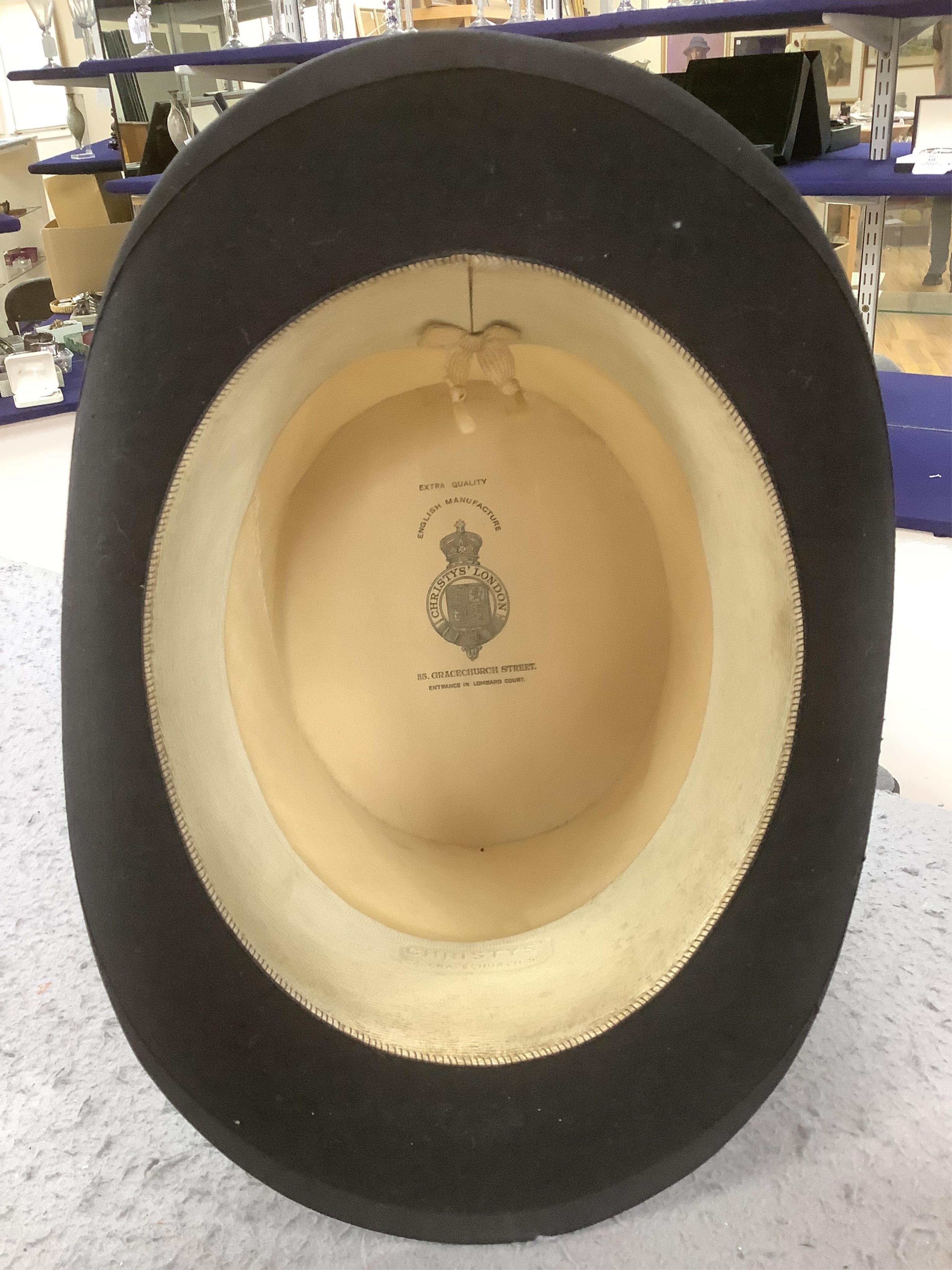Three gentlemen’s black silk top hats and a similar grey top hat and box. Condition - grey hat good, others poor